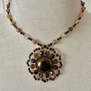 Brown and yellow beaded pendant necklace